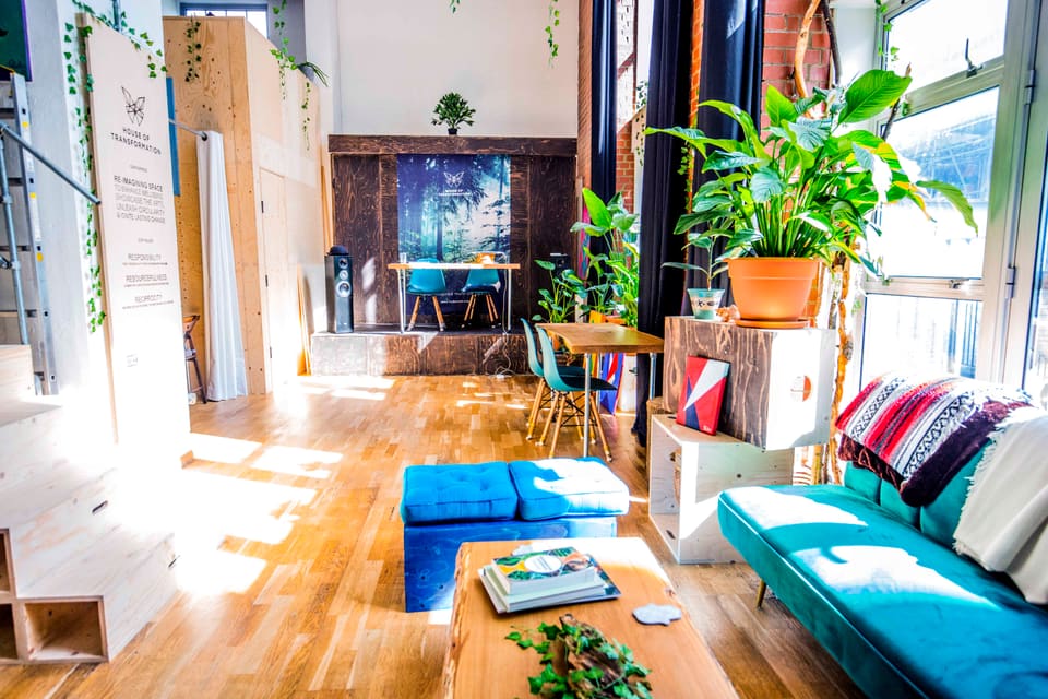 The quiet corner with its fireplace, bar stools and blue daybed
