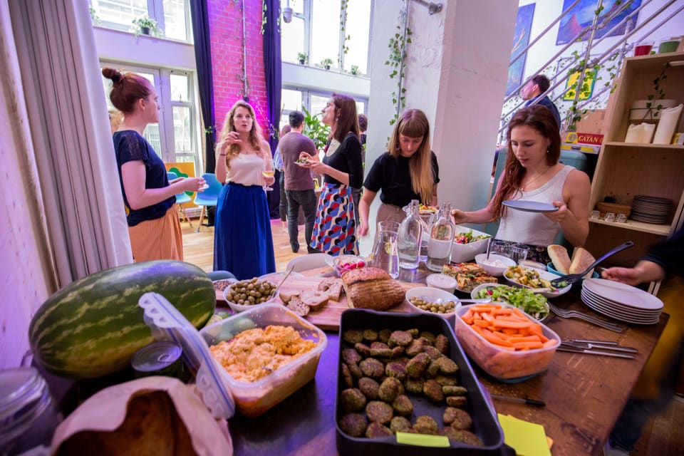 Guests serving themselves from a buffet during an event