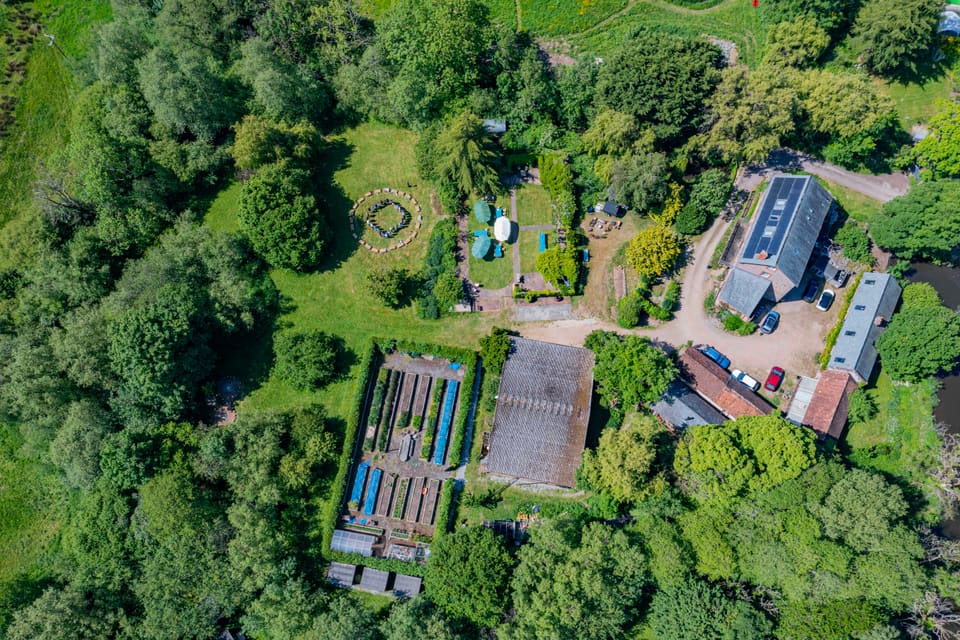 Selgars Mill from above — the mill house, lawns, vegetable garden and woods